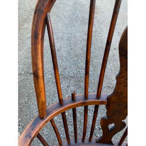 784 - A 19thC elm, ash and yew wood Windsor chair with crinoline stretcher.