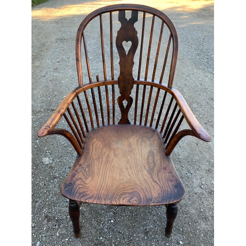 784 - A 19thC elm, ash and yew wood Windsor chair with crinoline stretcher.