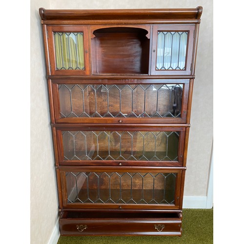 788 - A mahogany Globe Wernicke style bookcase. 86 w x 147 h x 24cms d.