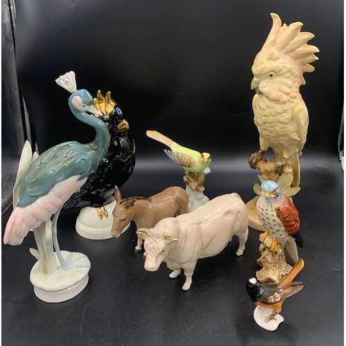 87 - Ceramic birds and animals to include Beswick donkey, bull and hawk, 2 Goebel birds and 3 Royal Dux b... 