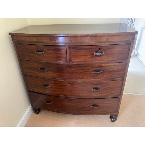 764a - A 19thC mahogany bowfront chest of 2 short over 3 long drawers on turned legs. 114cms w x 54cms d x ... 