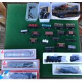 A collection of diecast model trains, carriages and miscellaneous train set parts from brands includ... 