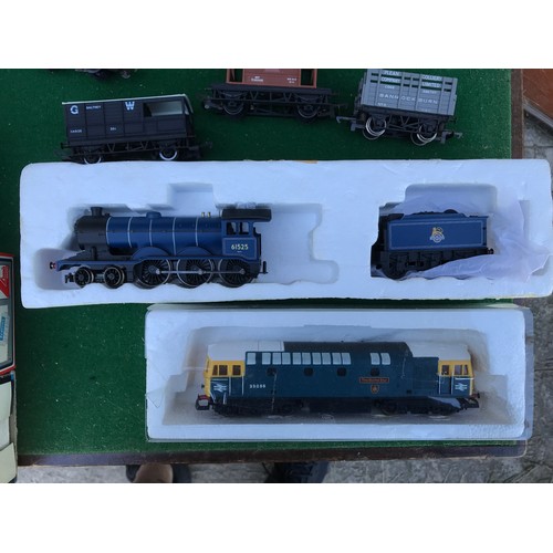 16 - A collection of diecast model trains, carriages and miscellaneous train set parts from brands includ... 