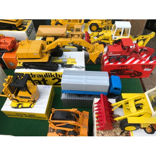 89 - A large collection of diecast toys of mostly NZG Models to include 160 Cat 245 Excavator, 223 Cat 95... 