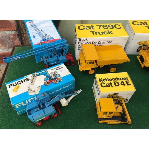 104 - A collection of NZG models to include No. 222 Cat 796C x 2, 190 Cat215, 256 Grove Manlift MZ 76, 205... 