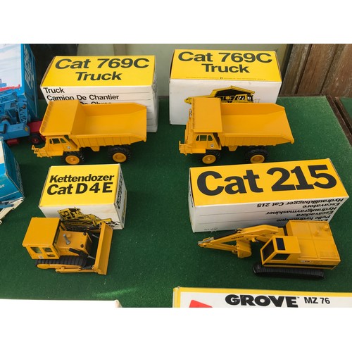 104 - A collection of NZG models to include No. 222 Cat 796C x 2, 190 Cat215, 256 Grove Manlift MZ 76, 205... 