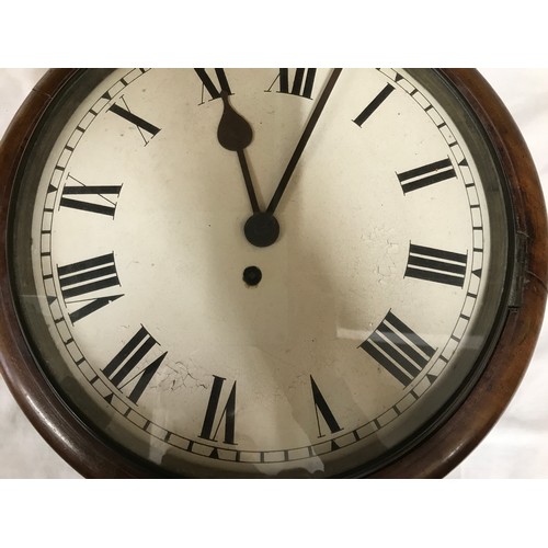 665 - A Railway clock with Fusee movement and Roman numerals in a mahogany case with glass front 38cms d.