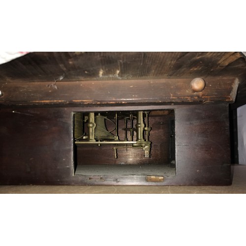 665 - A Railway clock with Fusee movement and Roman numerals in a mahogany case with glass front 38cms d.