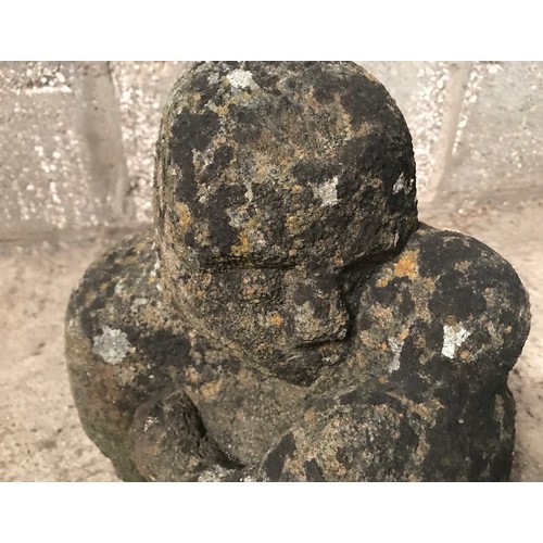 1320 - A stone figure of a man and child. Approx 35cms h x 30cms w.