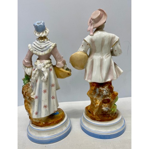 134 - A pair of 19thC figures, a man and woman both with roses. 30cms h.