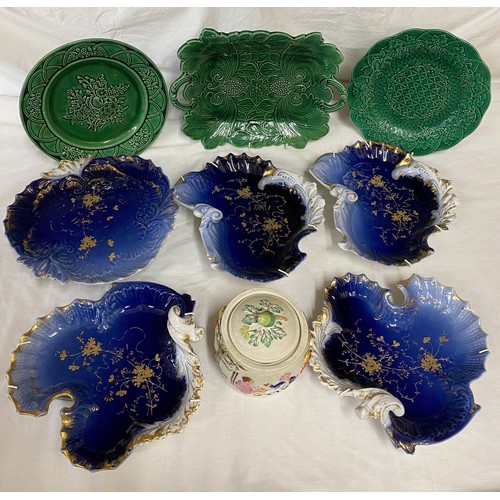 114 - A collection of ceramics to include 4 dishes and one pedestal dish in  blue, white and gold by M Red... 