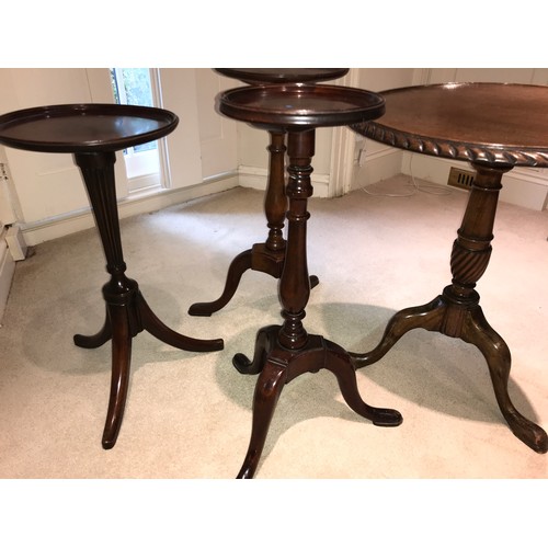 1206 - Four mahogany pedestal tables on tripod bases.