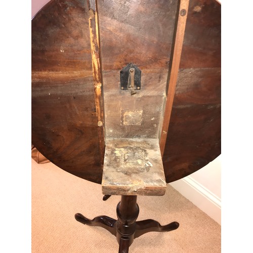 1207 - A 19thC mahogany tiptop tripod table. 67 d x 72cms h.