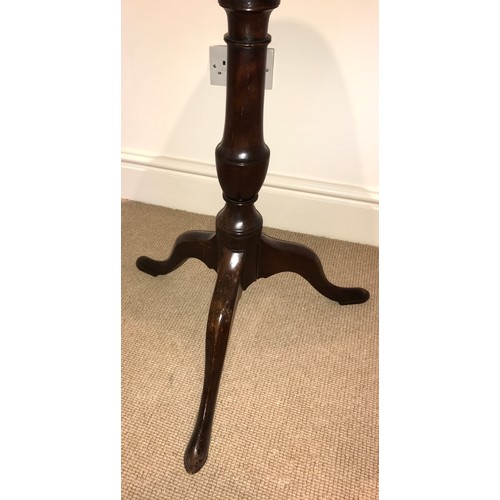 1207 - A 19thC mahogany tiptop tripod table. 67 d x 72cms h.