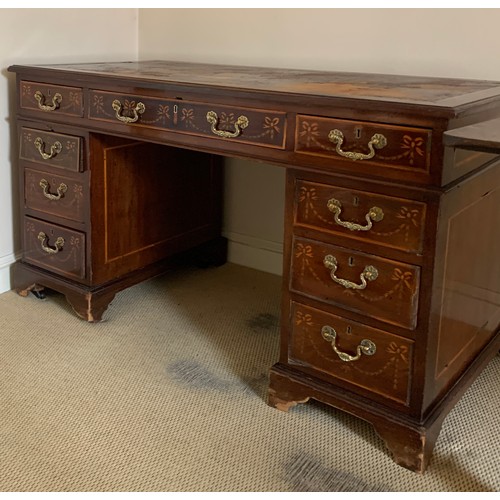 1210 - An Edwardian mahogany inlaid kneehole desk with garland and string inlay. 134 x 68 x 75cms h.