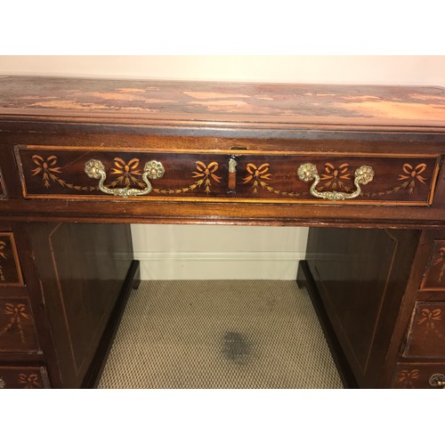 1210 - An Edwardian mahogany inlaid kneehole desk with garland and string inlay. 134 x 68 x 75cms h.