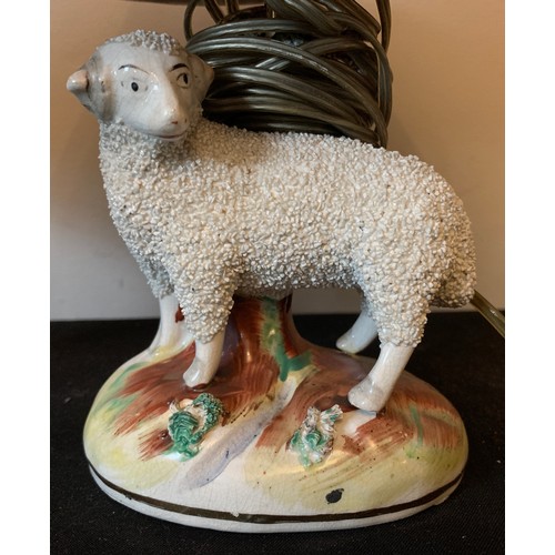 121 - Two 19thC Staffordshire sheep converted into table lamps. Sheep 13cms.