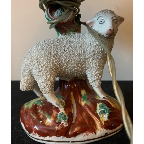 121 - Two 19thC Staffordshire sheep converted into table lamps. Sheep 13cms.