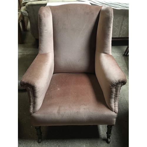 1192 - A 19thC wingback armchair on turned legs, pot castors, later upholstered. 80cms w, height to back 99... 