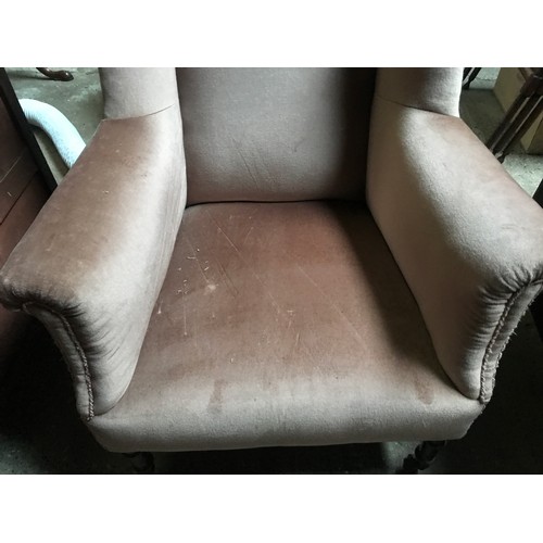 1192 - A 19thC wingback armchair on turned legs, pot castors, later upholstered. 80cms w, height to back 99... 