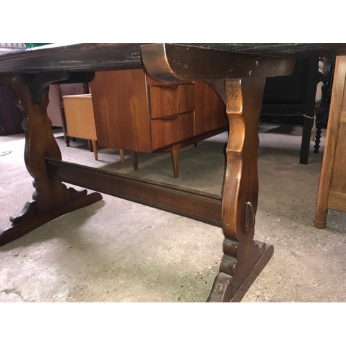 1193 - Ercol dark wood refectory dining table, 151 l x 77 w x 72cms h.