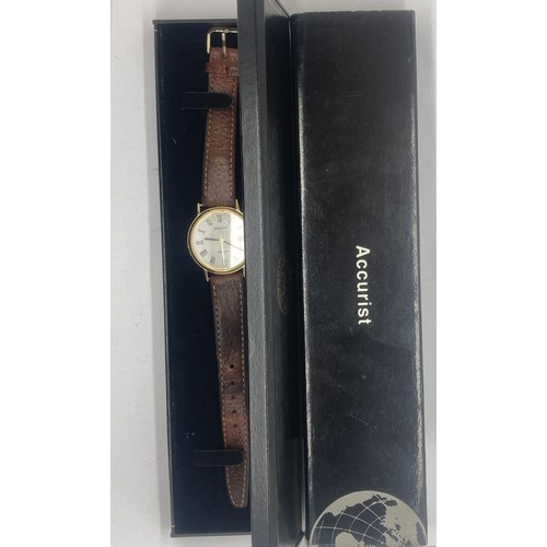 654 - An Accurist Gold 9ct gold gentleman's wristwatch with Roman numerals. 33mm case.