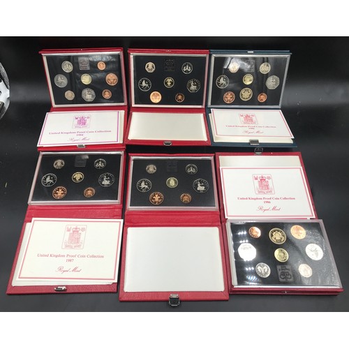 625 - A collection of Royal Mint UK cased proof coin sets, 1984,1985,1986 x 2, 1987 and 1988.