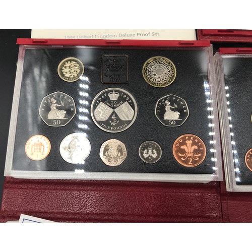 628 - Three Royal Mint UK Proof Coin sets to include 1997 with Prince Philip and Queen Elizabeth Wedding, ... 