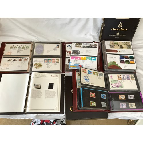 631 - Stanley Gibbons Collectors World Albums, three albums of First Day Covers and stamps including Jerse... 