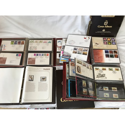 631 - Stanley Gibbons Collectors World Albums, three albums of First Day Covers and stamps including Jerse... 