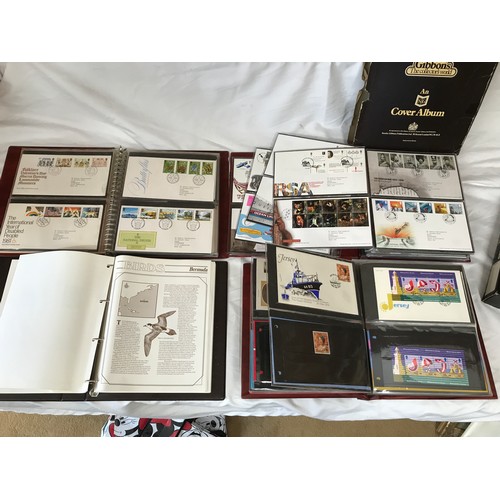 631 - Stanley Gibbons Collectors World Albums, three albums of First Day Covers and stamps including Jerse... 