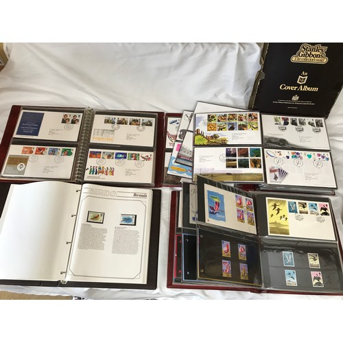 631 - Stanley Gibbons Collectors World Albums, three albums of First Day Covers and stamps including Jerse... 