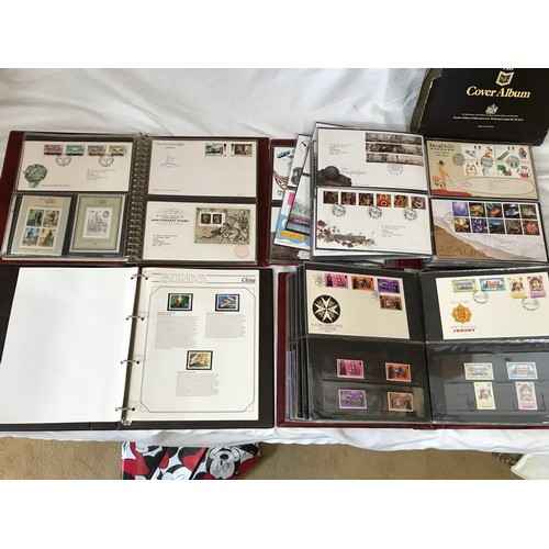 631 - Stanley Gibbons Collectors World Albums, three albums of First Day Covers and stamps including Jerse... 