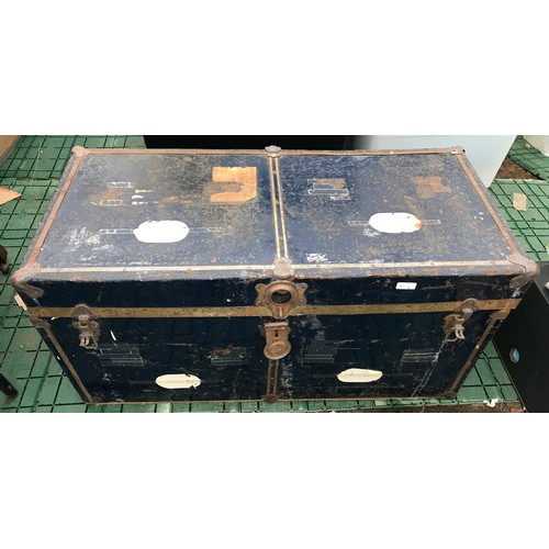 634 - A large blue metal travel trunk. 92cm w x 43cms d x 46cms h.