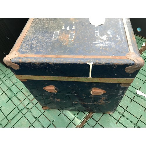 634 - A large blue metal travel trunk. 92cm w x 43cms d x 46cms h.