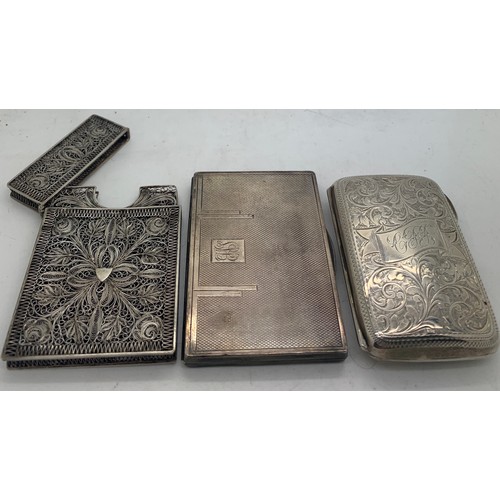 518 - A hallmarked silver cigarette case with foliate scroll engraving Chester 1899 maker William Aitken, ... 