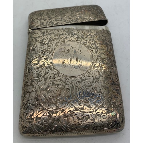 536 - A silver card case Birmingham 1893 with foliate scroll engraving. Initialled to front. 69gms.