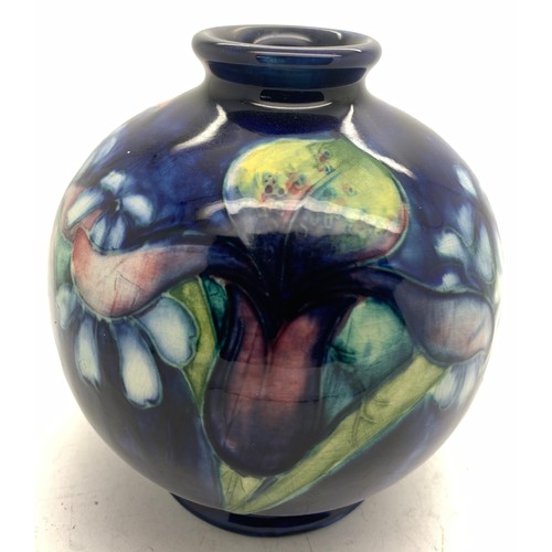 77 - Moorcroft vase, 11.5cms h, blue ground Iris pattern.