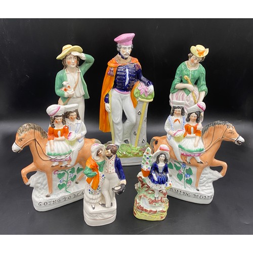 78 - Seven Staffordshire Figurines to include two flat backs. Tallest 32cms, smallest 16cms. All a/f.