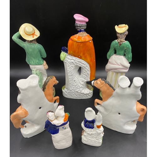 78 - Seven Staffordshire Figurines to include two flat backs. Tallest 32cms, smallest 16cms. All a/f.