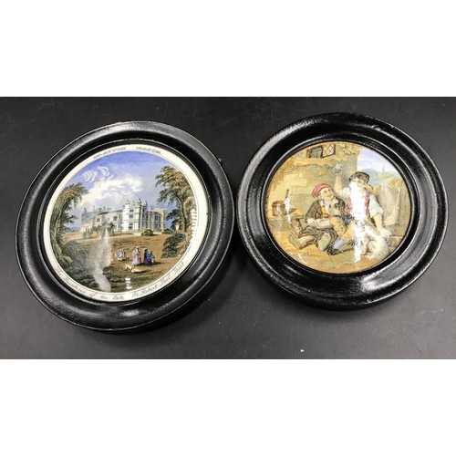 83 - Two 19thC pot lids in ebonised wooden frames, one depicting 2 men drinking, the other of Drayton Man... 