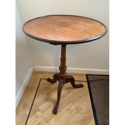 1227 - A 19thC mahogany tripod table. 49cms d x 69cms h.