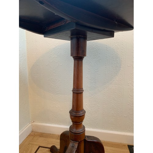 1227 - A 19thC mahogany tripod table. 49cms d x 69cms h.