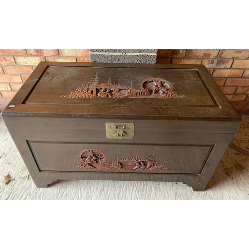 1228 - A camphorwood chest with carving to the top and front, tray to interior and brass fittings. 101 x 51... 