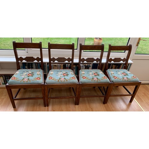 1229 - Four mahogany bar backed dining chairs with wool work drop in seats.