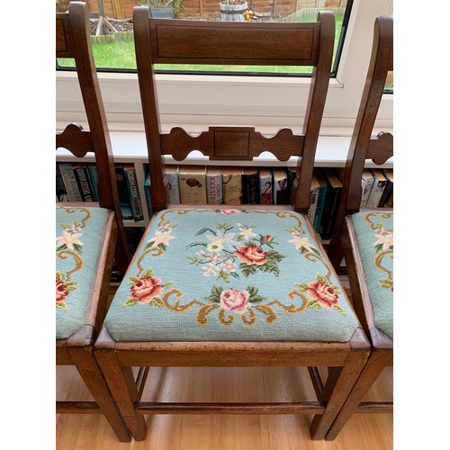 1229 - Four mahogany bar backed dining chairs with wool work drop in seats.