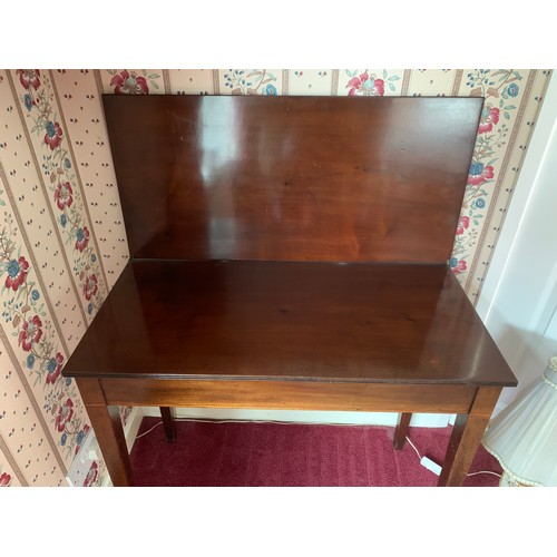 1231 - A 19thC fold over mahogany tea table. 85cms w x 41cms d x 74cms h.