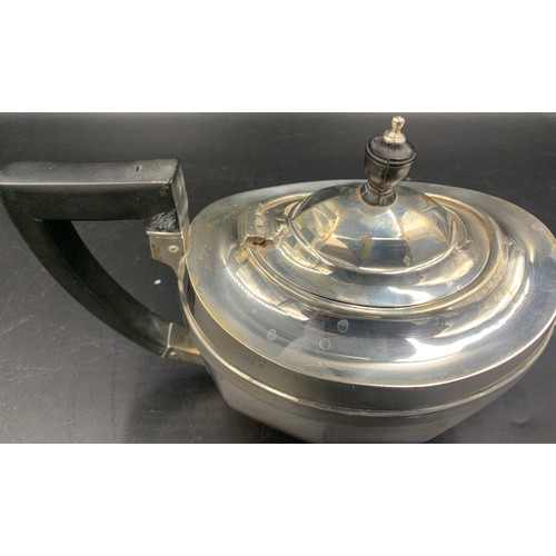 527 - Silver teapot with ebony handle & knop. Chester 1928. 590gms.