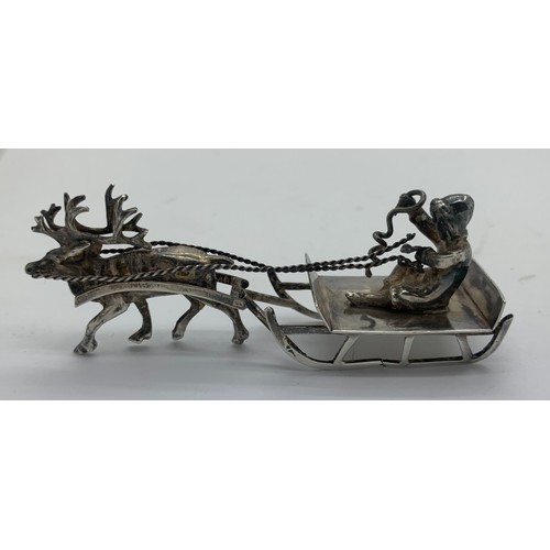 535 - Silver sleigh, pulled by a reindeer, import marks for Chester 1899. 28gms. 8cms l.