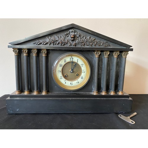 655 - A 19thC black slate mantle clock with six Corinthian columns to the front and a white enamelled chap... 